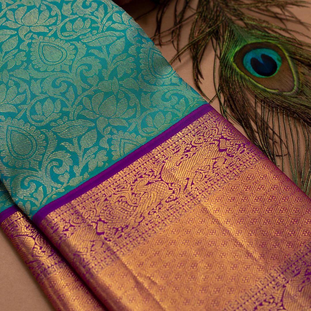 Floral aqua Kanjivaram saree with Contrast Zari & Jacqaurd Border